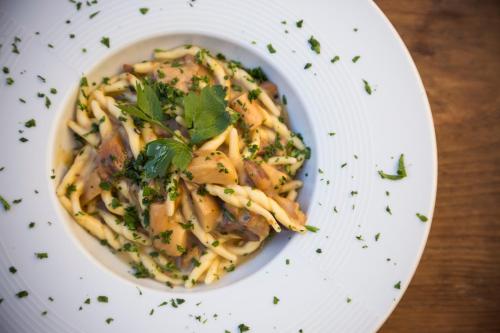 a plate of food with pasta on a table at Masseria Fortificata Lo Zafferaneto in Buccheri