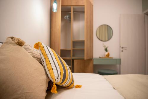 a bedroom with a bed with pillows on it at Cross Caraiman View 1 in Buşteni
