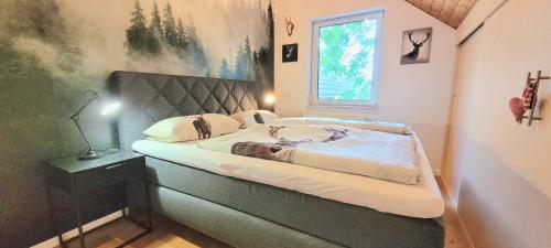 Llit o llits en una habitació de Schwarzwaldliebe Neuried 20 Min zum Europa Park