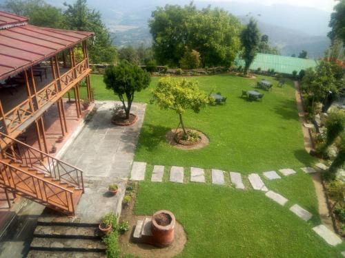 an aerial view of a garden with a building at Eco Lodge Chevron in Kausani