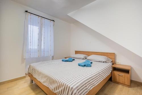 Ένα ή περισσότερα κρεβάτια σε δωμάτιο στο Apartman Robert Cres