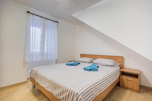 Postel nebo postele na pokoji v ubytování Apartman Robert Cres