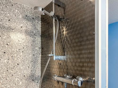 a shower with a shower head in a bathroom at The Corn Store - Uk44693 in Cheadle