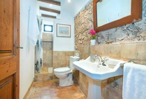 a bathroom with a sink and a toilet at Son March Petite in Pollença