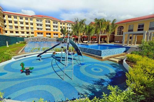 Der Swimmingpool an oder in der Nähe von Affordable 2BR condo unit @ a cozy place in Cebu
