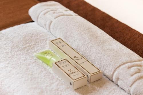 a group of threeented candles sitting on top of a towel at Royal Mackintosh Hotel in Dunbar