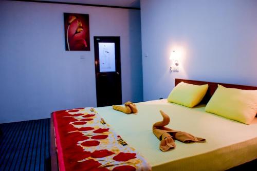Ένα ή περισσότερα κρεβάτια σε δωμάτιο στο Okeed Ella