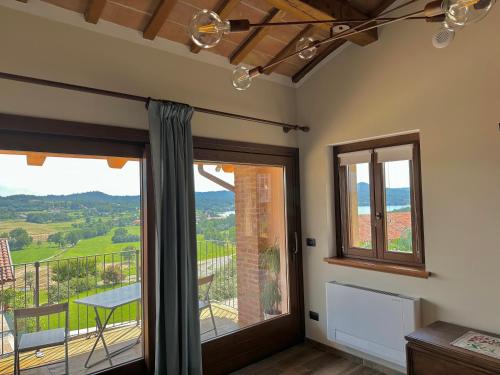 a room with a large window with a view at Cascina Coste in Roppolo