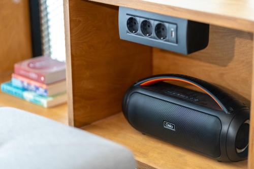a black radio sitting on a shelf in a room at 4C Rethymno in Skaleta