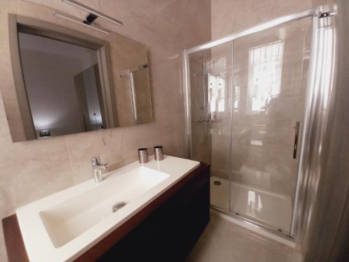 a bathroom with a sink and a shower at Luxury Penthouse with private pool in Tas-Samra