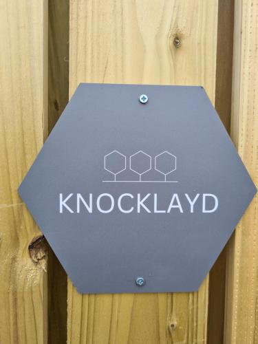 a blue sign that says kockellaw on a wooden door at Causeway Coast Retreats in Dervock