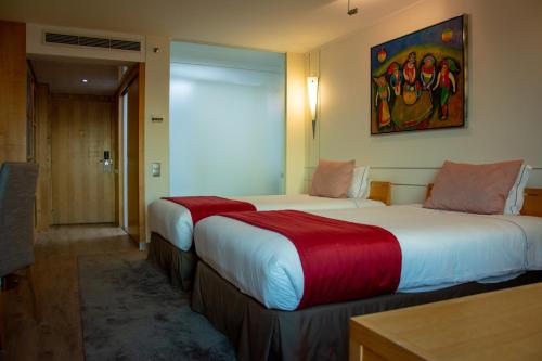 Кровать или кровати в номере VIP Executive Entrecampos Hotel & Conference