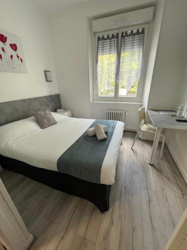Postel nebo postele na pokoji v ubytování Hôtel Agena