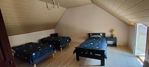 Katil atau katil-katil dalam bilik di Maison Voutré