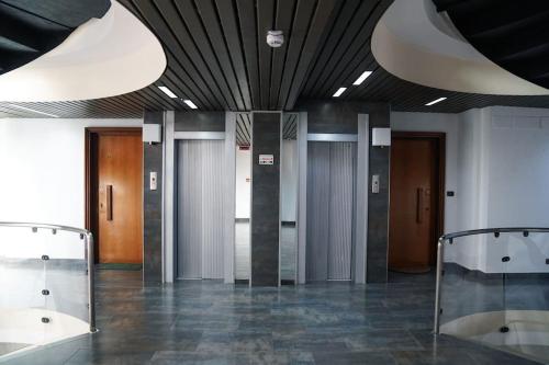 a lobby with many elevators in a building at Villa Bonelli Loft in Rome