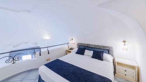 Ein Bett oder Betten in einem Zimmer der Unterkunft Hotel Nettuno