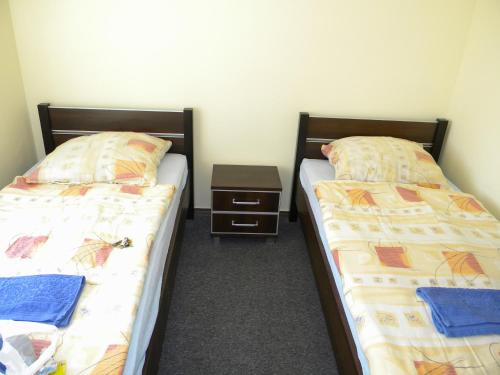 Łóżko lub łóżka w pokoju w obiekcie Pokoje Gościnne Saritas