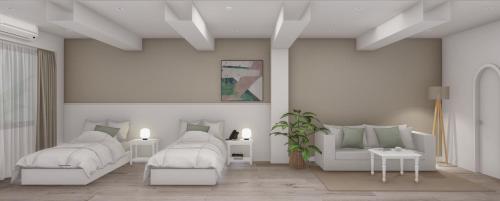 Habitación blanca con 2 camas y sofá en Gardi Hotel & Suites en Buenos Aires