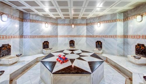 a room with a table in the middle of it at Bera Konya Hotel in Konya