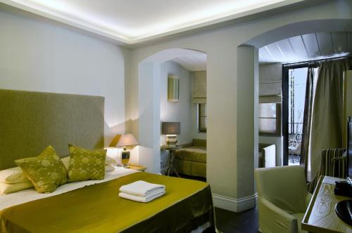Ένα ή περισσότερα κρεβάτια σε δωμάτιο στο Hotel Valeri