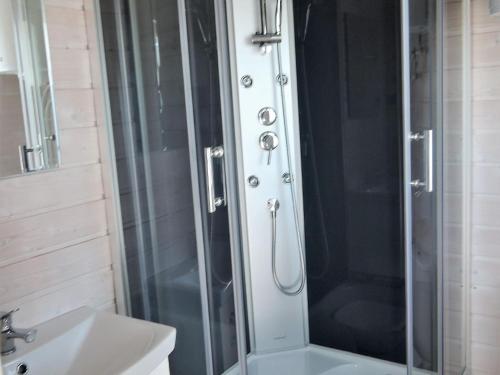 a bathroom with a shower and a sink at New holiday homes for 3 people in Dziwnówek in Dziwnówek