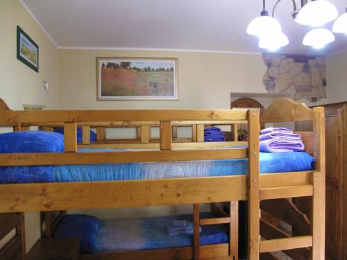 A bed or beds in a room at Diving Center Punta Stilo