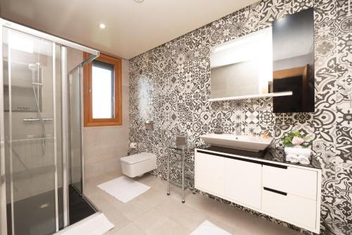 a bathroom with a toilet and a sink and a shower at Villa Dar Laila in Marrakech