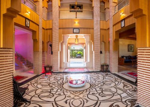 a large room with a lobby with a large rug at Villa Dar Laila in Marrakech