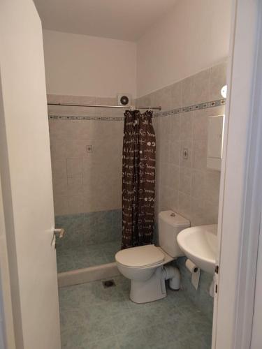 a bathroom with a toilet and a sink at Andreana's House in Antiparos