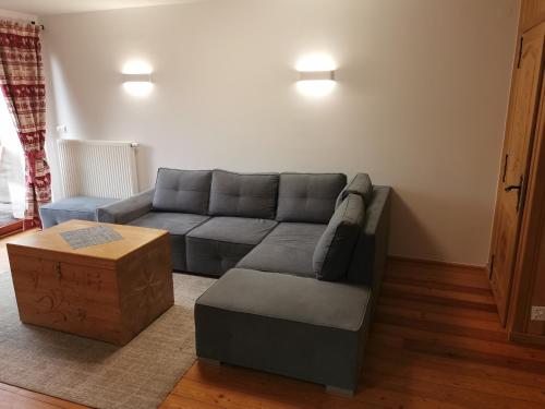 a living room with a couch and a coffee table at Zakopane apartament in Zakopane