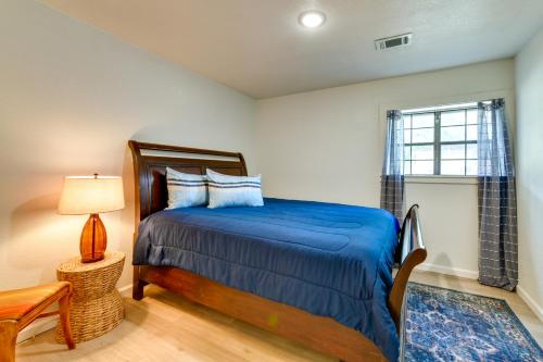 a bedroom with a bed and a window at Jonesboro Retreat Near Arkansas State University! in Jonesboro