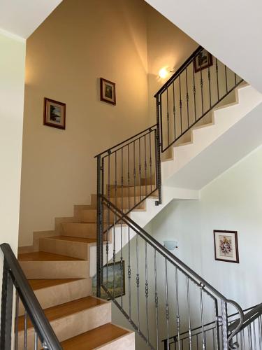 a staircase in a home with white walls and wooden floors at Assisi il Panorama in Petrignano