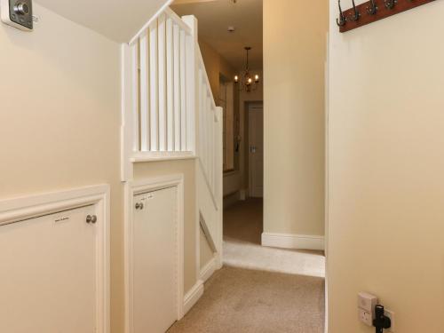 a hallway with stairs in a house at Wansfell Loft in Ambleside