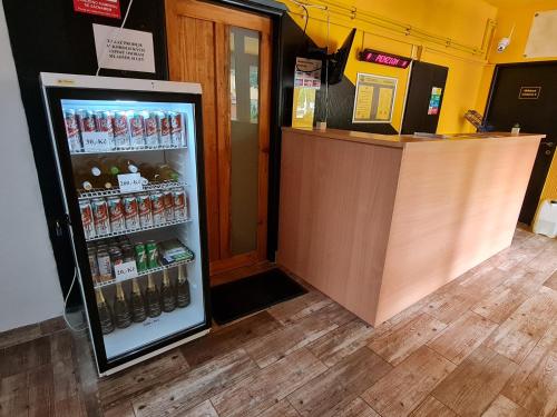 a refrigerator filled with lots of bottles of beer at NIKA beds in Pardubice
