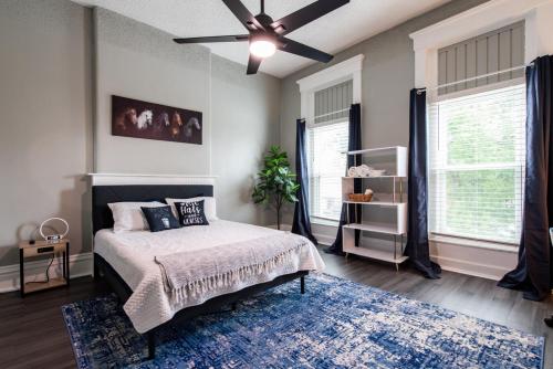a bedroom with a bed and a ceiling fan at Suite near downtown Louisville, KY - Suite V in Louisville