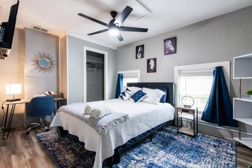 a bedroom with a bed and a ceiling fan at Suite near downtown Louisville, KY - Suite IX in Louisville