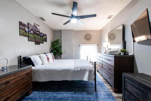 a bedroom with a bed and a ceiling fan at Suite near downtown Louisville, KY - Suite XII in Louisville