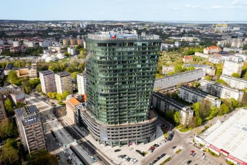 an aerial view of a tall building in a city at Miodowy Apartament w Hanza Tower -Sauna&Pool in Szczecin