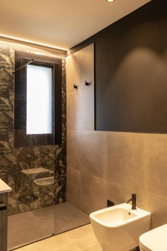 Bagno di ApartmentsGarda - Residenza Garda Deluxe