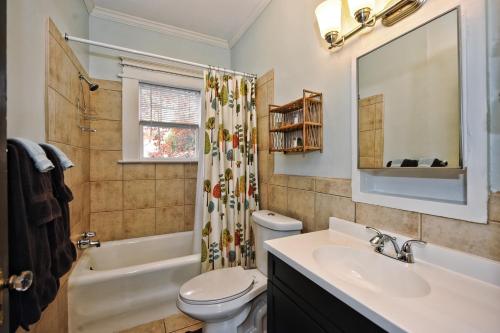 a bathroom with a sink and a toilet and a shower at The Home Collection CLT: Kirkwood Avenue in Charlotte