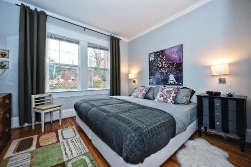 a bedroom with a large bed and a window at The Home Collection CLT: Kirkwood Avenue in Charlotte