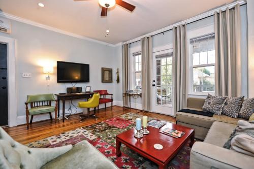 a living room with a couch and a table at The Home Collection CLT: Kirkwood Avenue in Charlotte