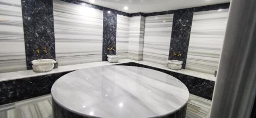 a bathroom with a large white tub in a room at Best life 6 in Alanya