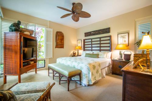 a bedroom with a bed and a ceiling fan at Kapalua Villas Maui - Select Your Unit in Kahana