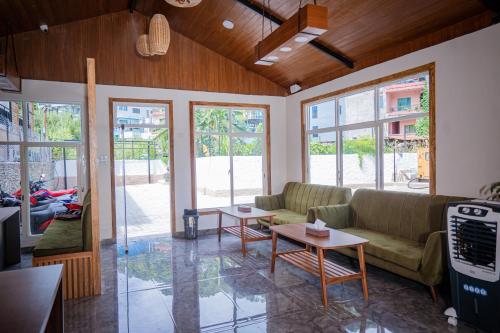 a living room with a couch and a table at Majestic Lake Front Hotel & Suites in Pokhara