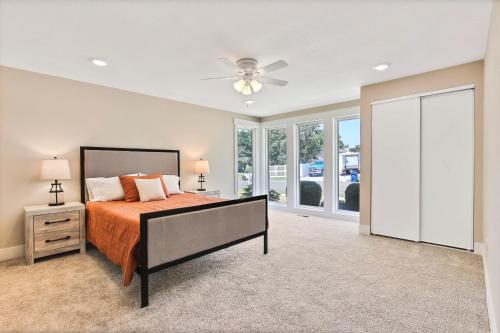 a bedroom with a bed and a ceiling fan at Stunning Golf Course Retreat 4BR Home in Eagle