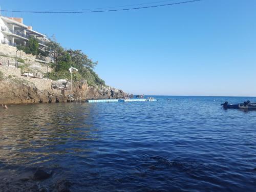 a large body of water with a boat in it at Nino Lux Apartments Ulcinj in Ulcinj