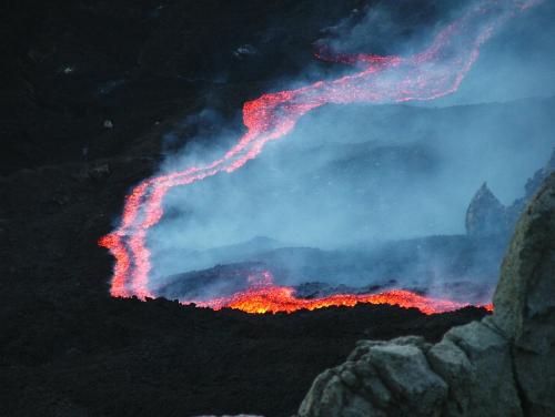 an eruption of a volcano at night at B&B Le Tre rose dell'Etna in Zafferana Etnea