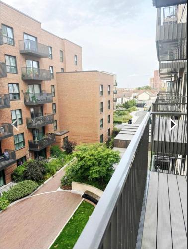 an apartment balcony with a view of a building at Studio flat greenleaf walk in Southall