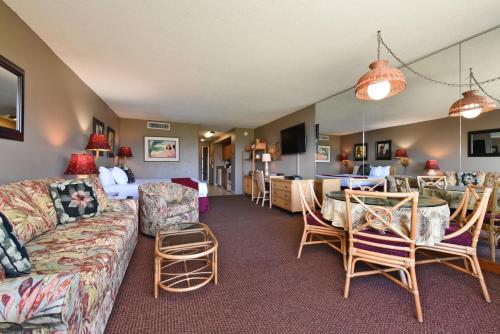 a living room with a couch and a table at Maui Kaanapali Villas #A317 in Lahaina